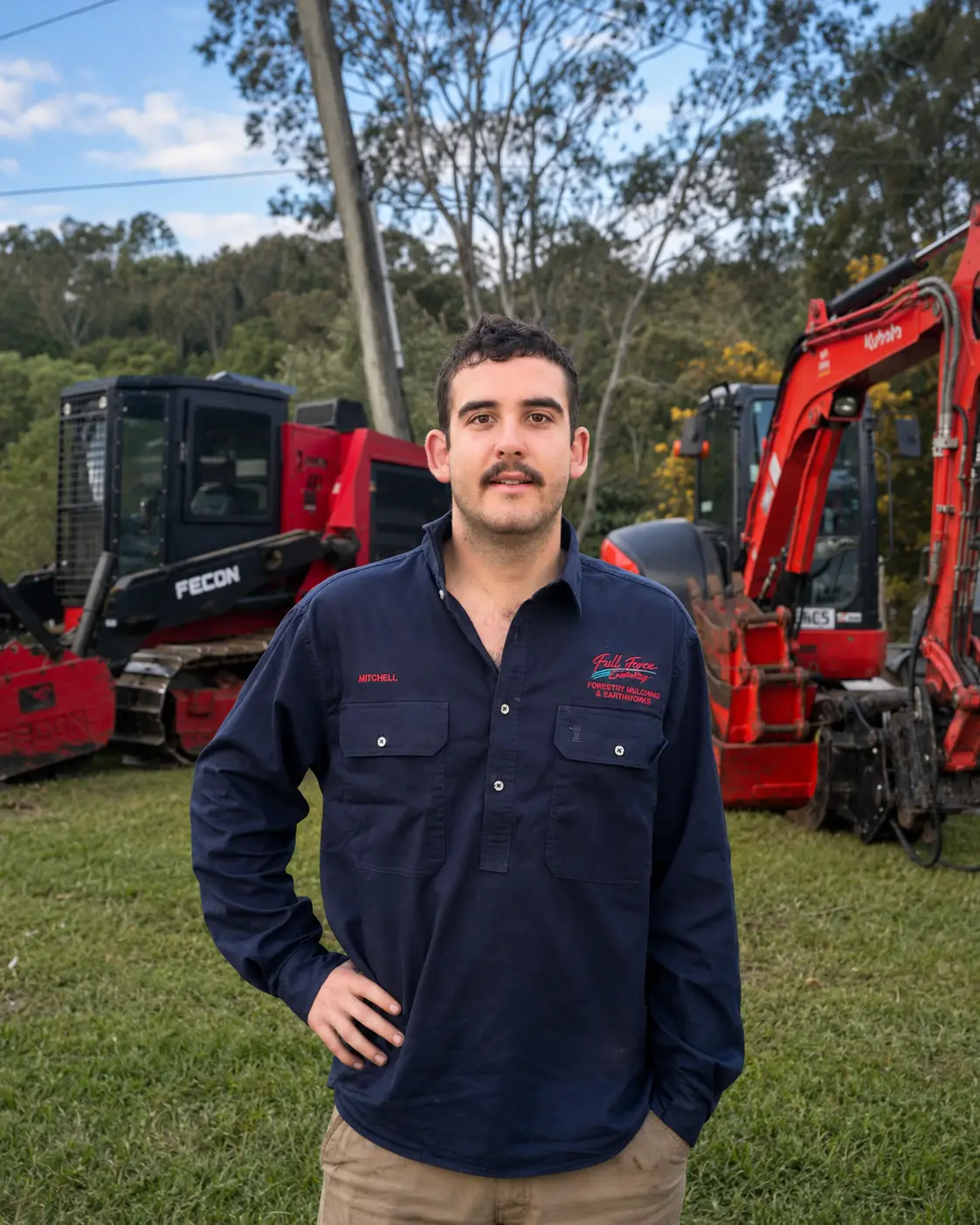 Mitch, owner of Full Force Contracting, on site with forestry mulching and excavation equipment in Queensland